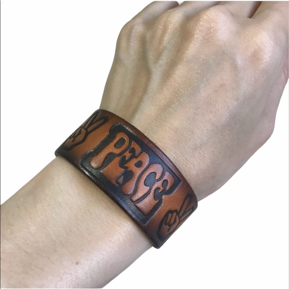 Carved Leather Peace Bracelet Brown language